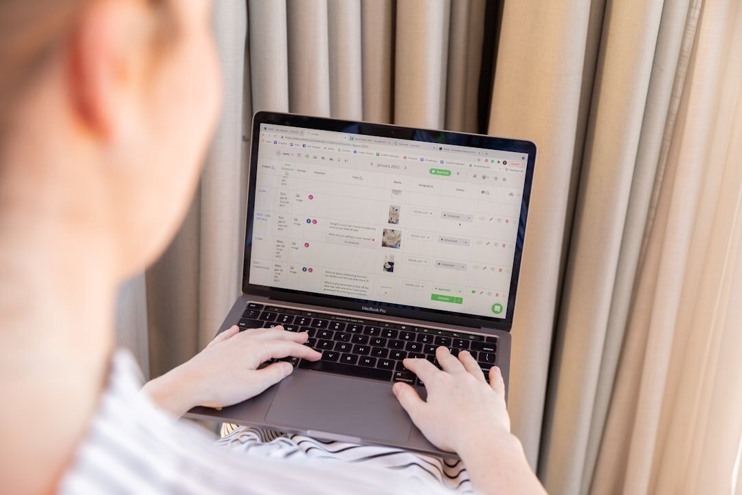 person checking credit score on laptop
