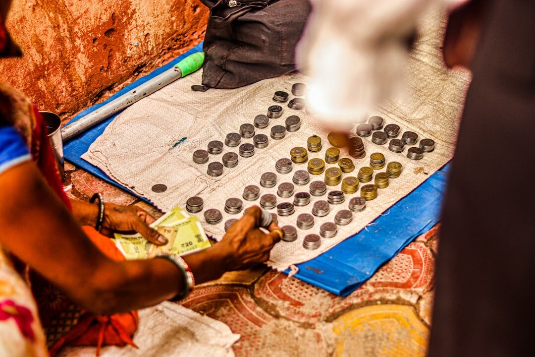person counting coins