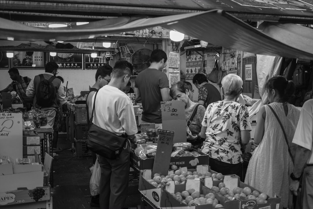 person negotiating at market stall