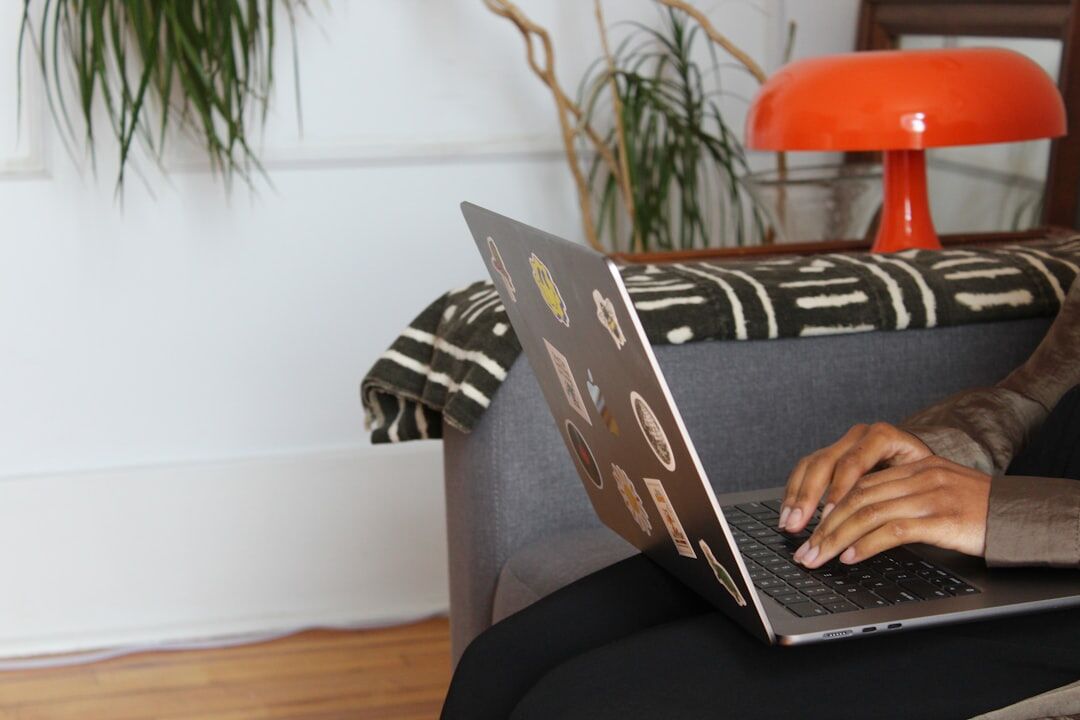 person working on laptop at home