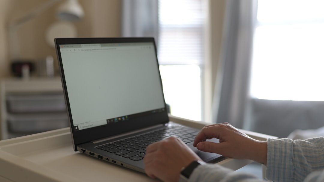 person working on laptop at home