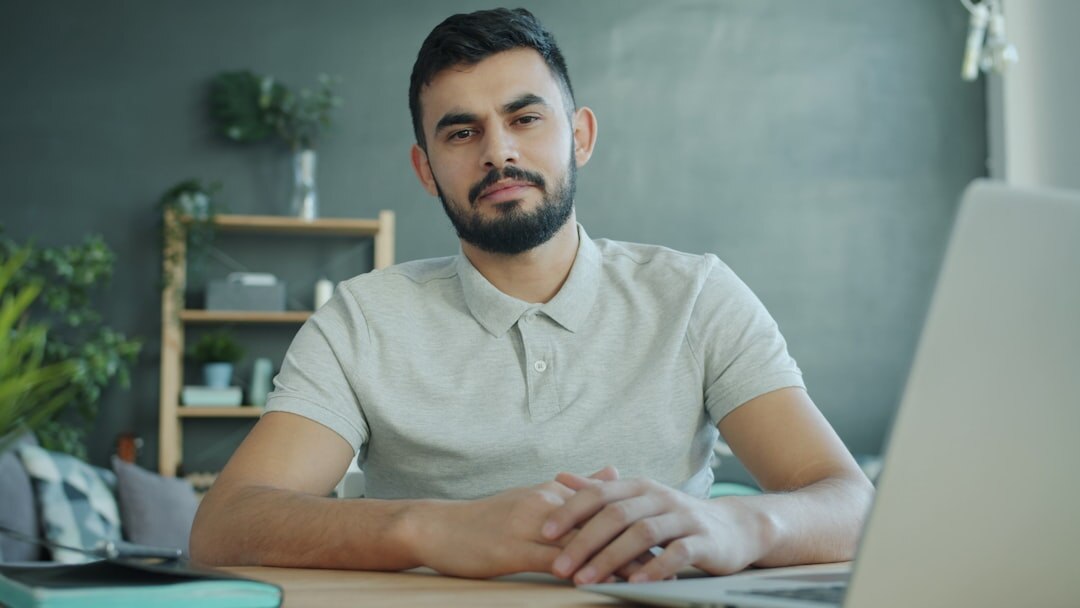 young professional at desk with laptop