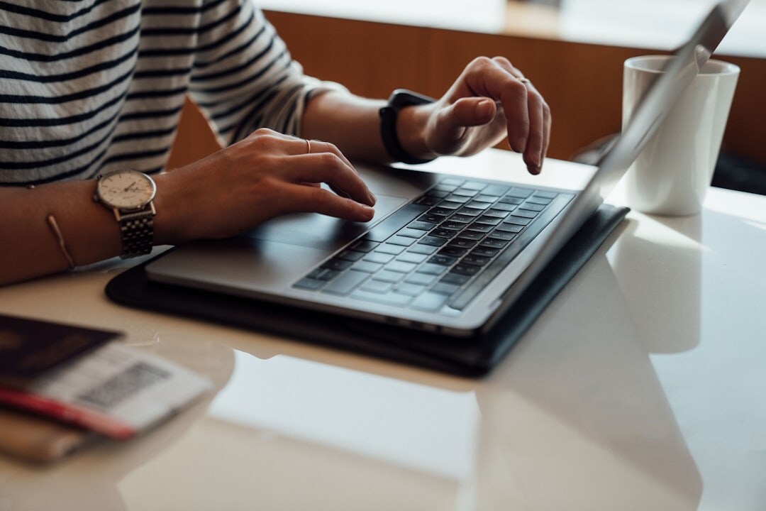 person checking credit score on laptop