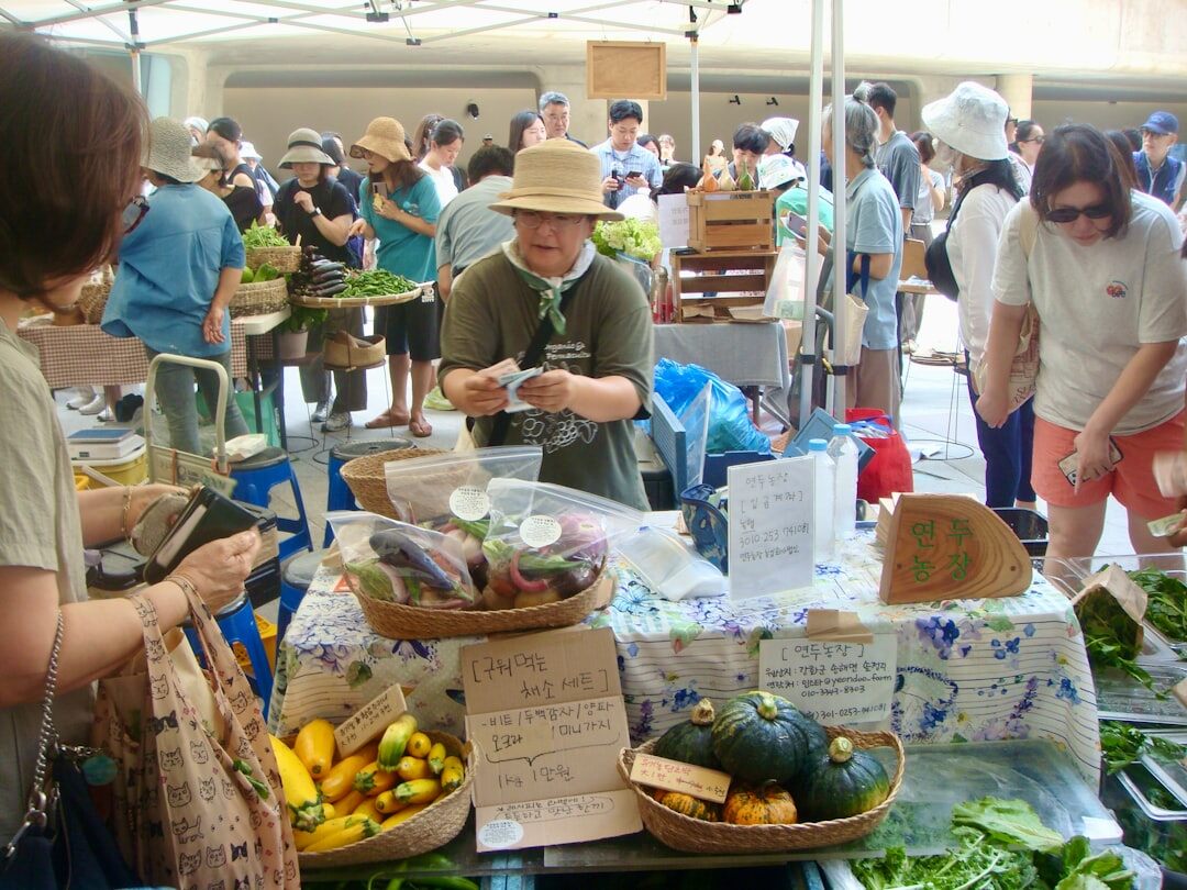 person negotiating at market stall