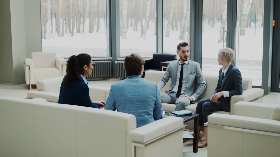 Diverse Malaysian finance team collaborating in a modern office