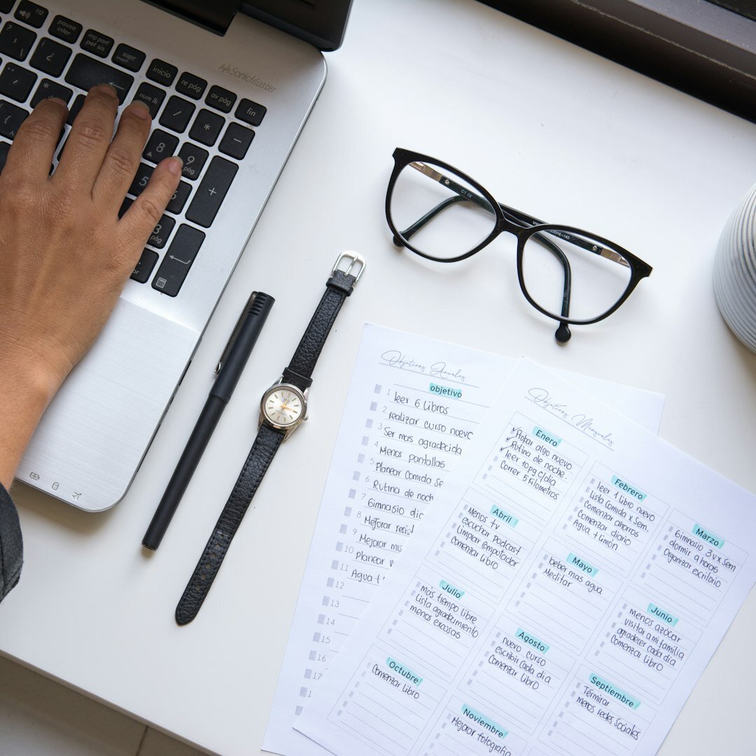 Budget planning spreadsheet and calculator on desk