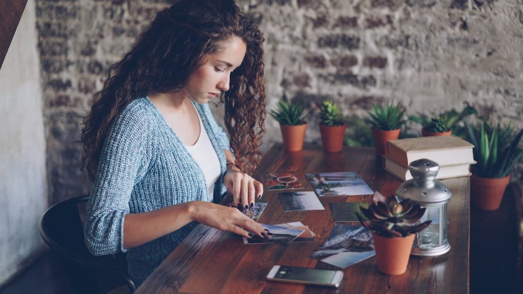 woman checking expenses on phone